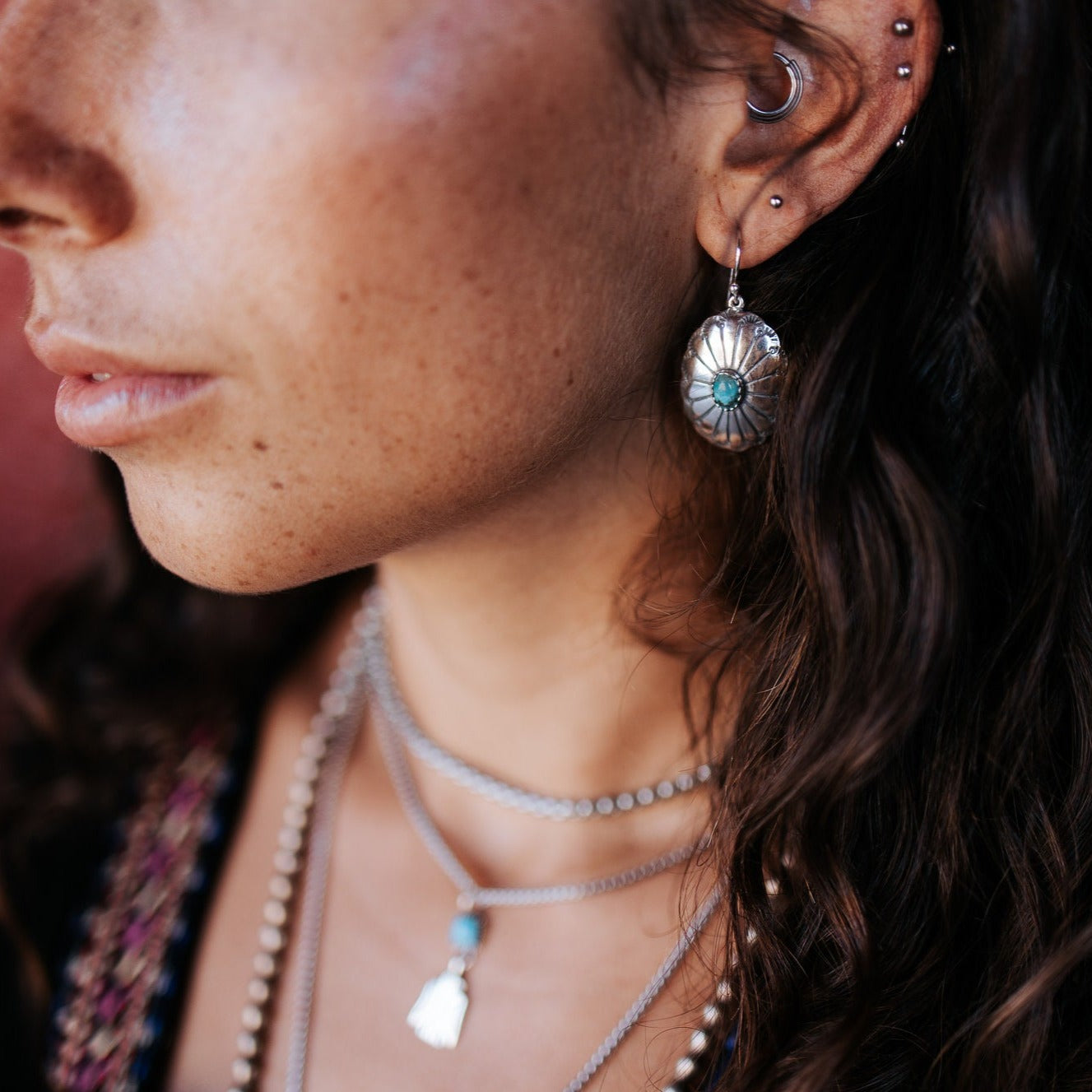 SOWELL JEWELRY Abeytu turquoise earrings in handcrafted sterling silver worn by a woman with bohemian style