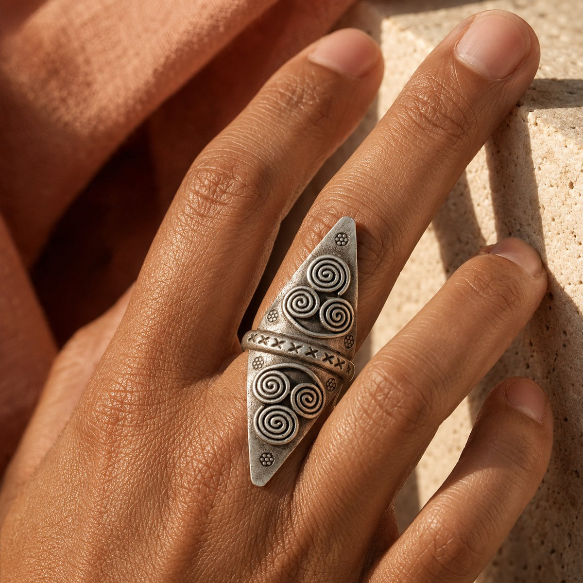 SOWELL JEWELRY Anada sterling silver statement ring with intricate etched spiral patterns on a finger