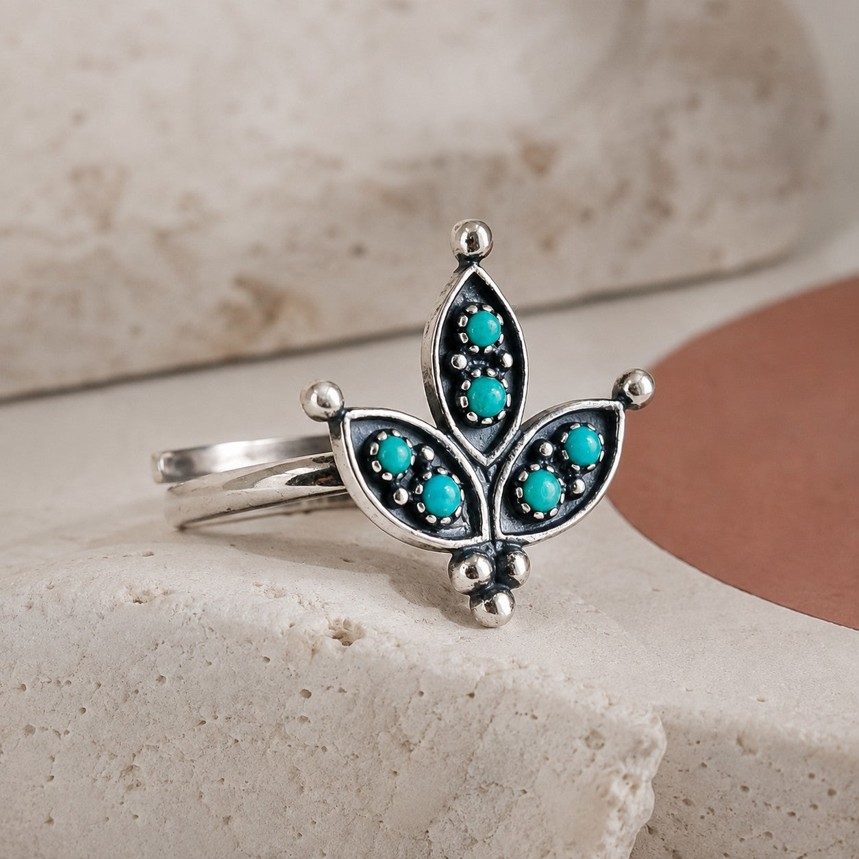 SOWELL JEWELRY sterling silver cactus flower ring featuring seven turquoise stones and intricate beadwork details.