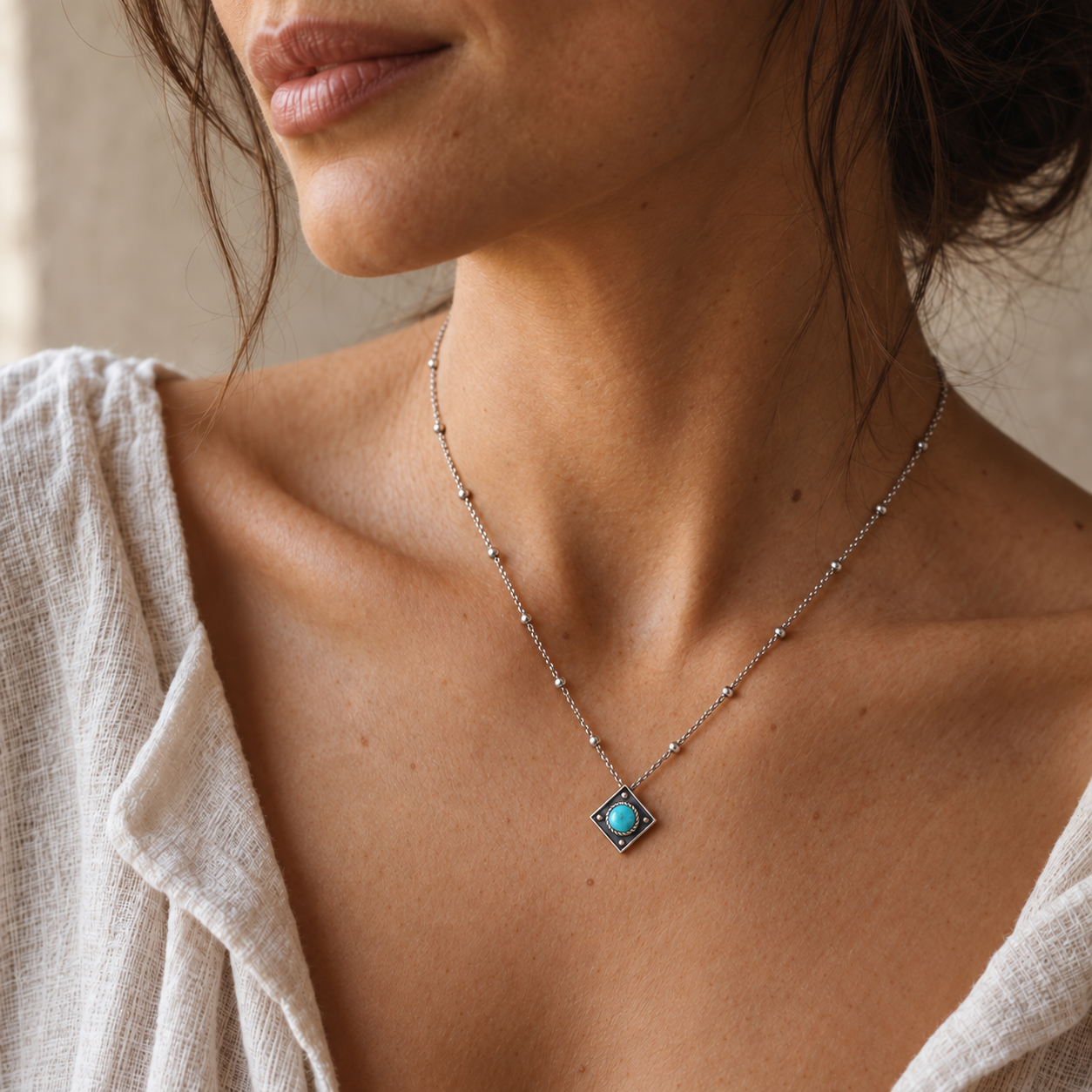SOWELL JEWELRY Catalina turquoise necklace featuring a round stone in a diamond-shaped oxidized sterling silver pendant