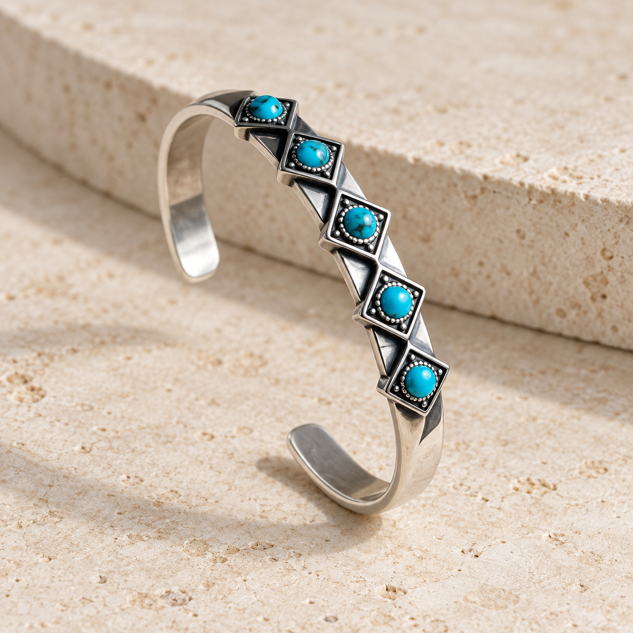 SOWELL JEWELRY Catalina sterling silver cuff bracelet featuring round turquoise stones in textured metal settings.