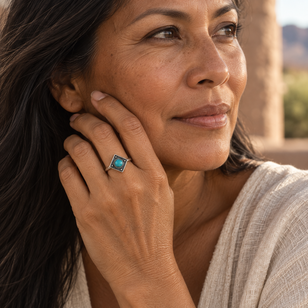 SOWELL JEWELRY Catalina sterling silver ring featuring a round turquoise stone on a woman's hand