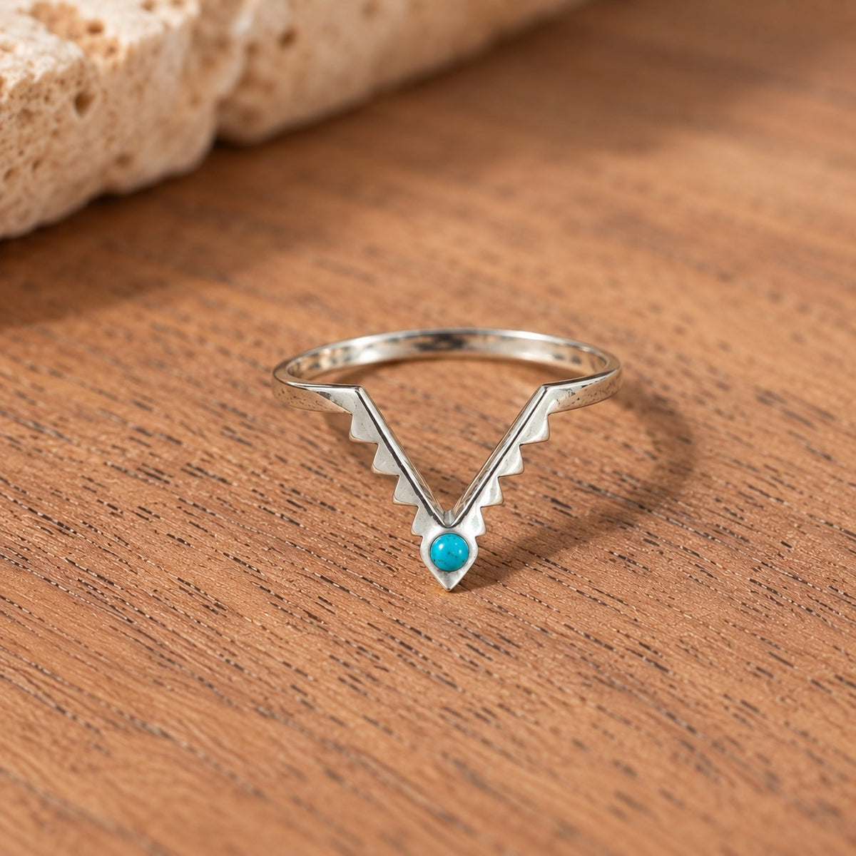 SOWELL JEWELRY Freya ring featuring a small round turquoise stone set in a V-shaped sterling silver band