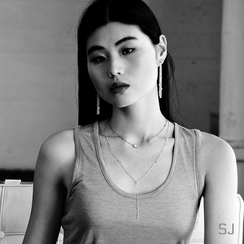 Model wearing a SOWELL JEWELRY Giulia sterling silver lariat necklace with cubic zirconia accents on a delicate chain.