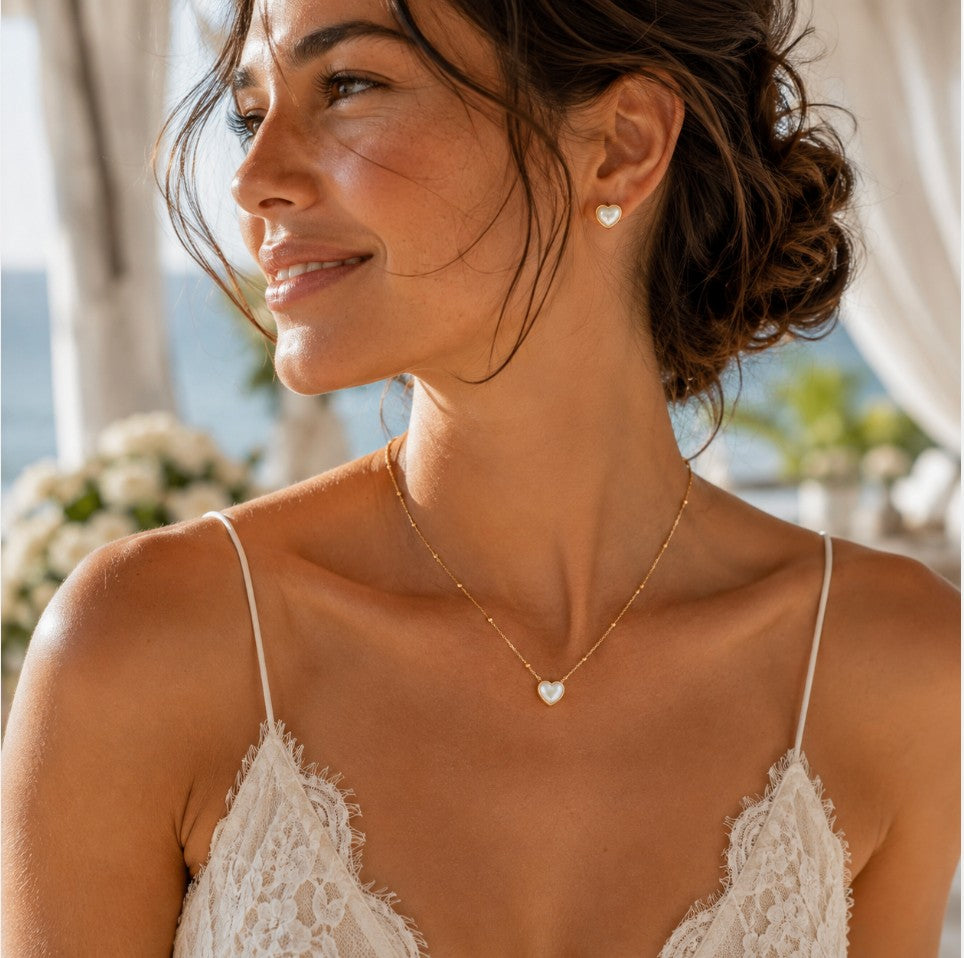SOWELL JEWELRY 18k gold vermeil heart necklace and matching stud earrings featuring iridescent mother of pearl stones.