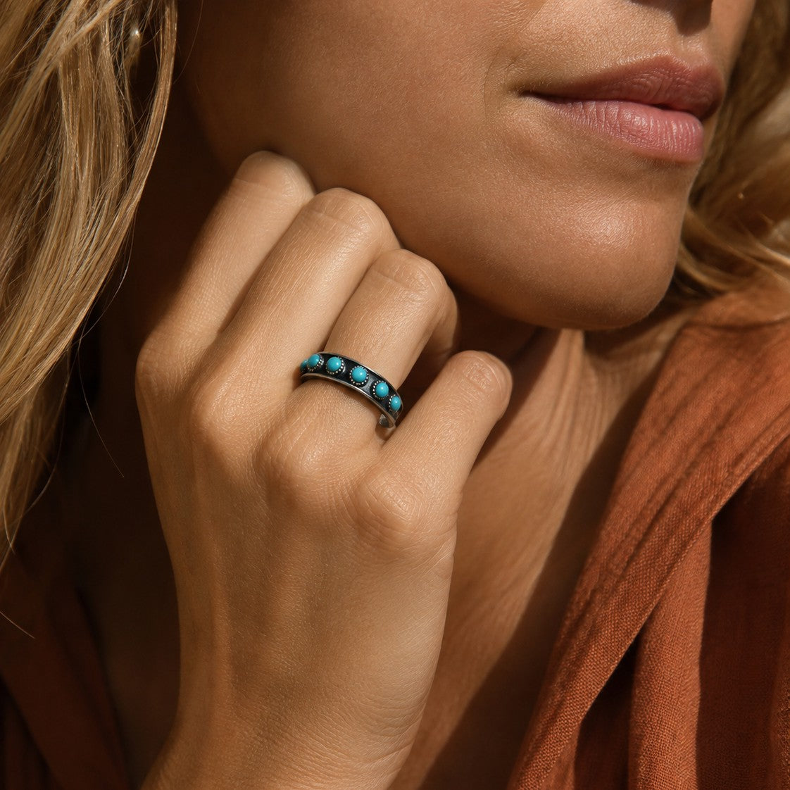 SOWELL JEWELRY Hachi adjustable sterling silver ring band featuring a row of genuine turquoise stones on a finger.