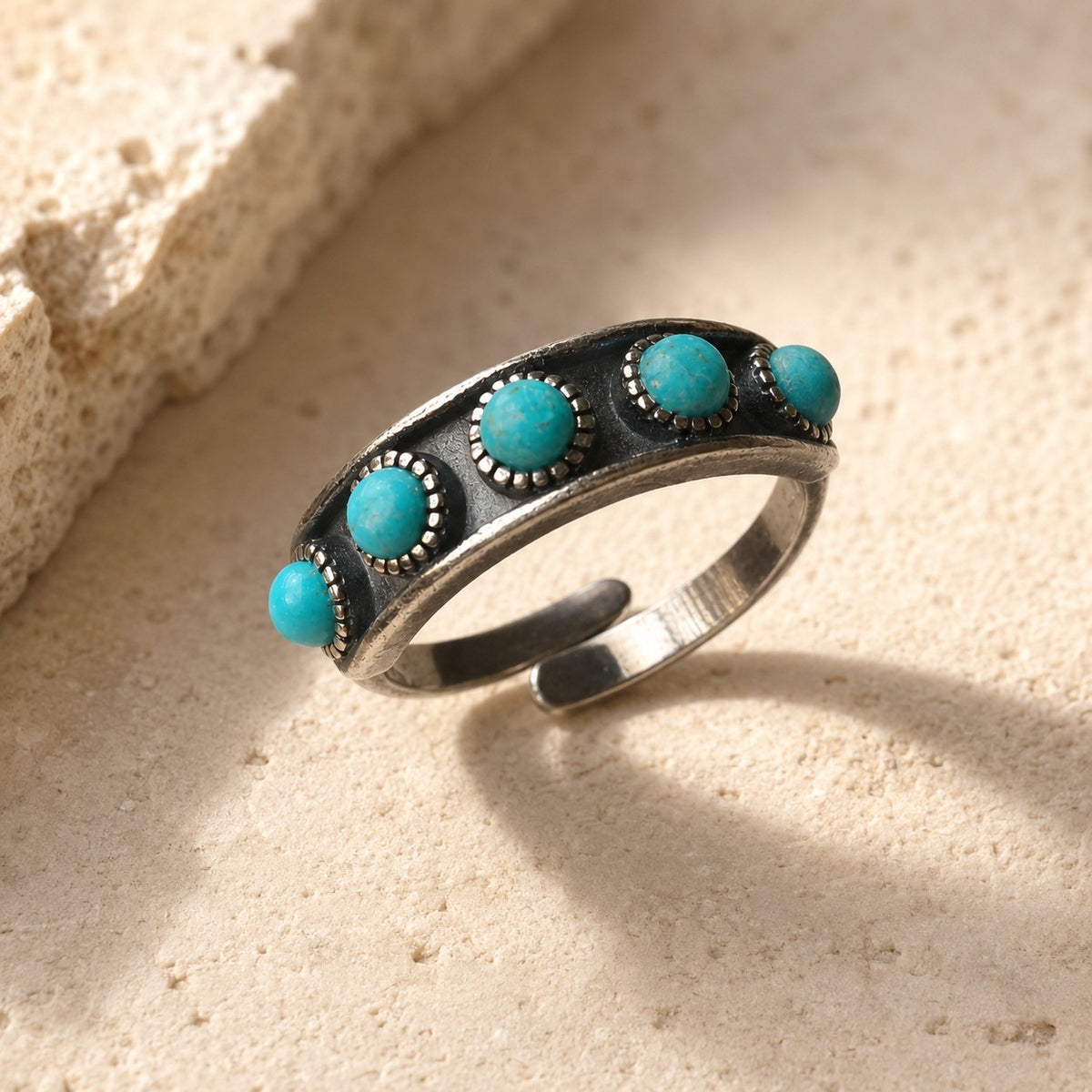 SOWELL JEWELRY Hachi adjustable sterling silver ring featuring a row of genuine turquoise stones on a textured band.