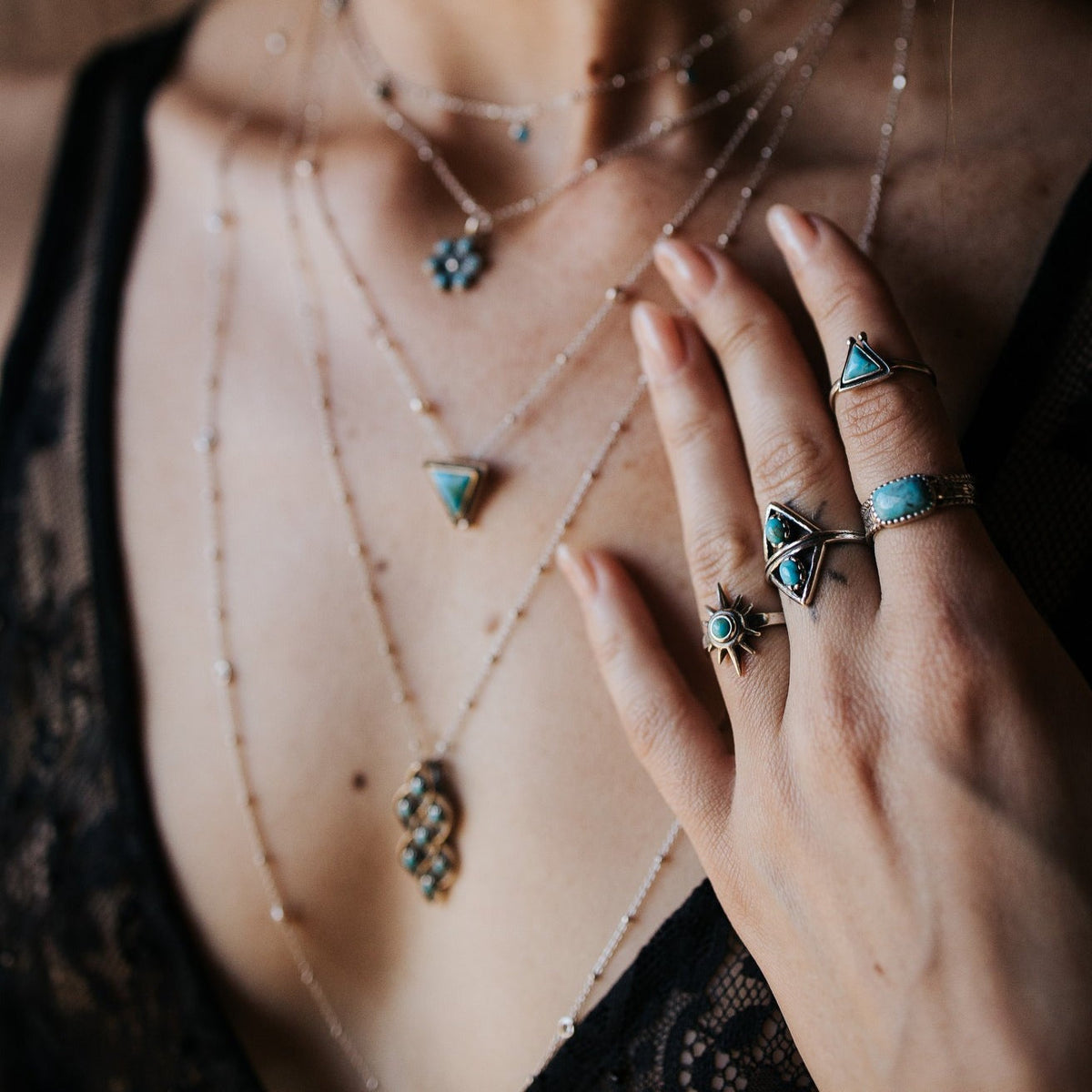 SOWELL JEWELRY Hanale turquoise ring featuring a triangular stone set in sterling silver on a model's hand