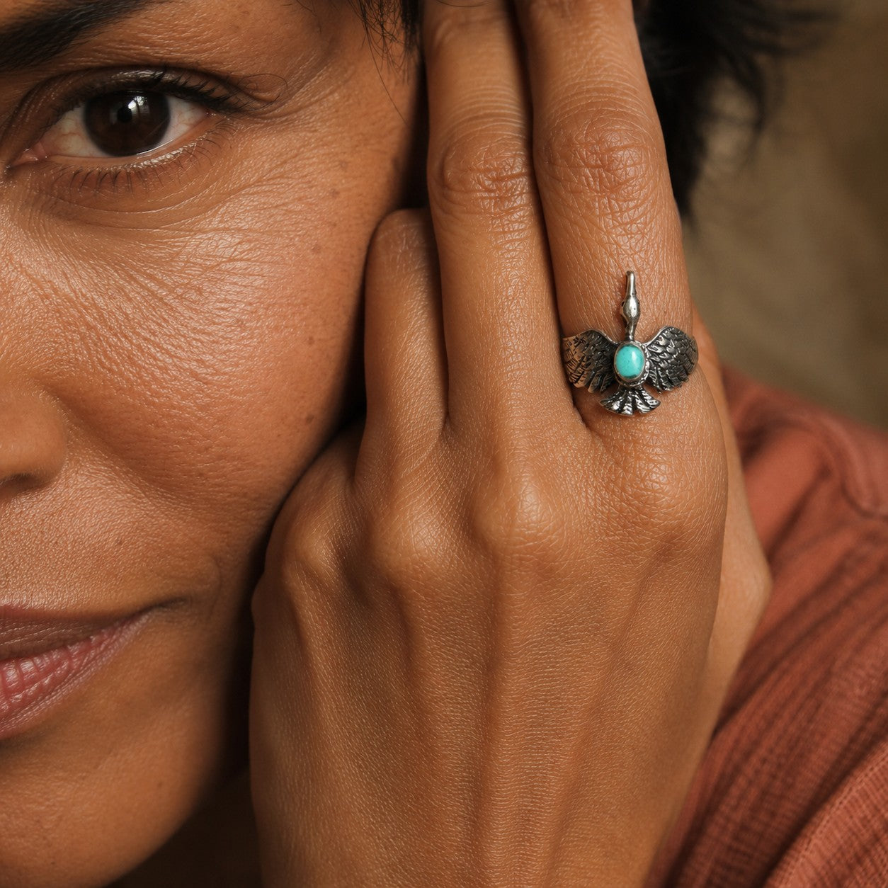 SOWELL JEWELRY sterling silver hawk ring with genuine turquoise stone worn on a woman's finger