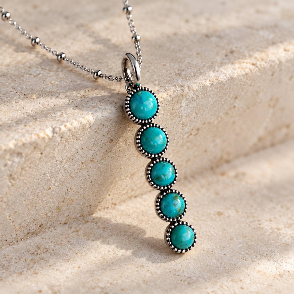 SOWELL JEWELRY Ilaria necklace featuring five round turquoise stones set in sterling silver on a delicate beaded chain.