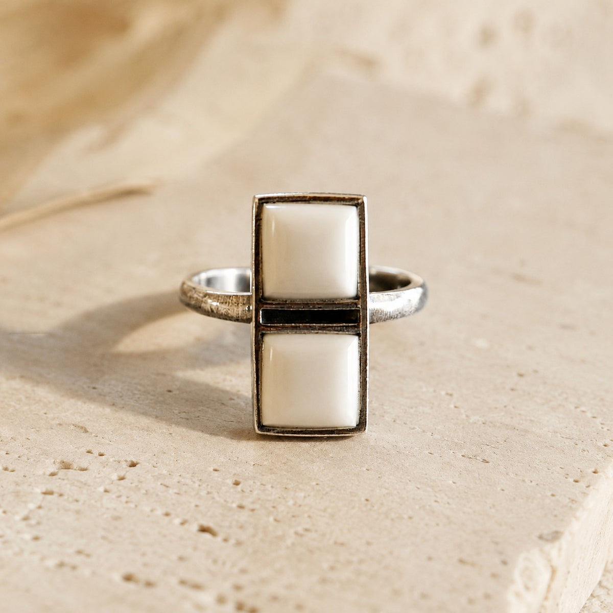 SOWELL JEWELRY Imala ring featuring two square white agate stones in a handcrafted sterling silver adjustable band.