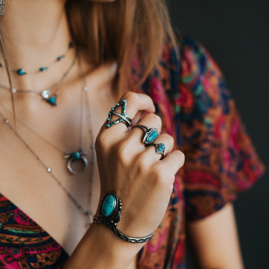SOWELL JEWELRY Jacy turquoise ring featuring five round stones set in sterling silver on a woman's hand