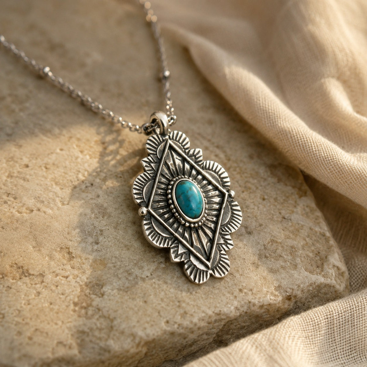 SOWELL JEWELRY Leif necklace featuring an oval turquoise stone set in ornate sterling silver on a delicate chain.