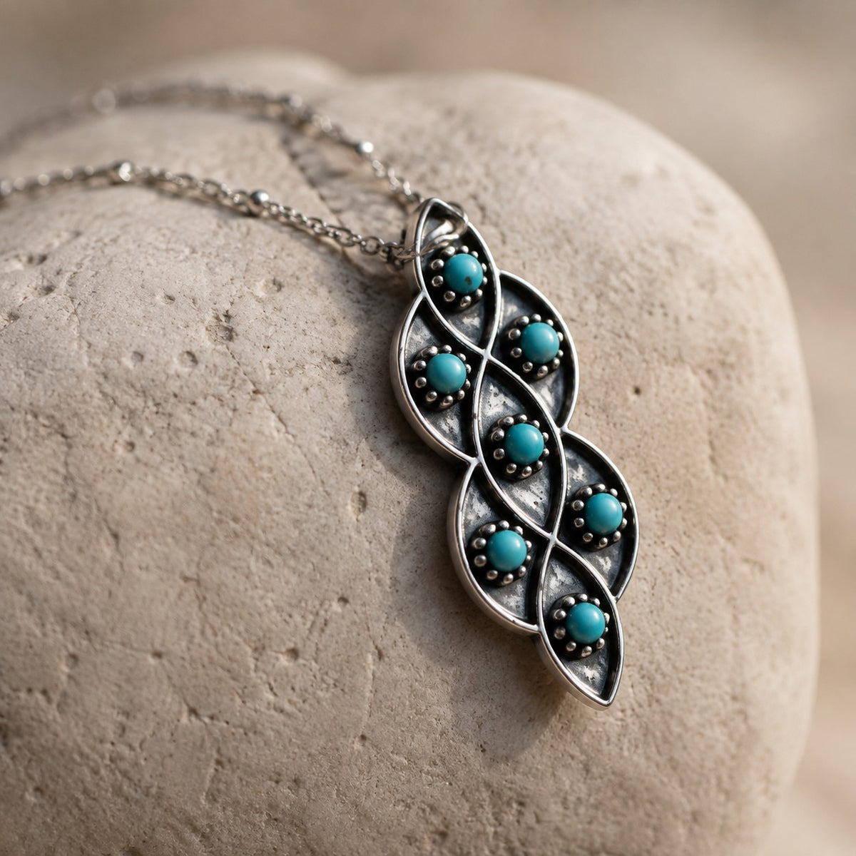 SOWELL JEWELRY Lucia necklace featuring six turquoise stones in an oxidized sterling silver lattice pendant
