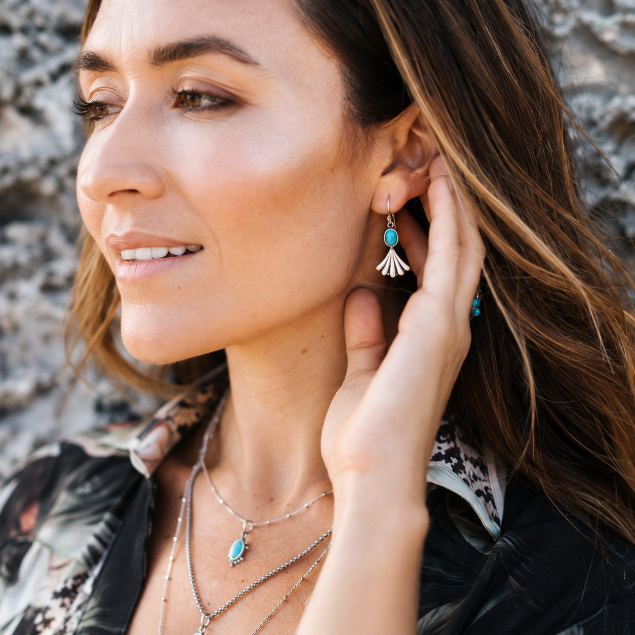 SOWELL JEWELRY Prayer turquoise earrings in sterling silver worn by a woman with a matching necklace