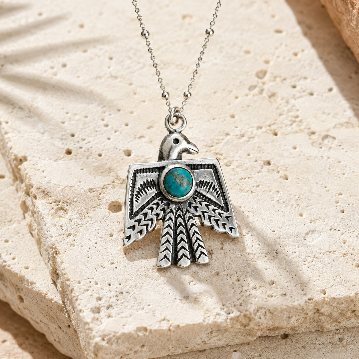 SOWELL JEWELRY Thunderbird necklace featuring a genuine turquoise stone set in handcrafted .925 sterling silver.