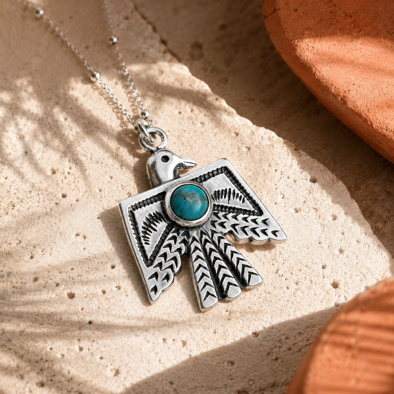SOWELL JEWELRY Thunderbird necklace featuring a genuine turquoise stone set in handcrafted .925 sterling silver