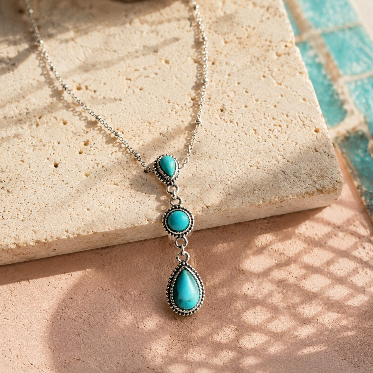 SOWELL JEWELRY Frida turquoise cascade necklace featuring three teardrop and round stones set in .925 sterling silver.