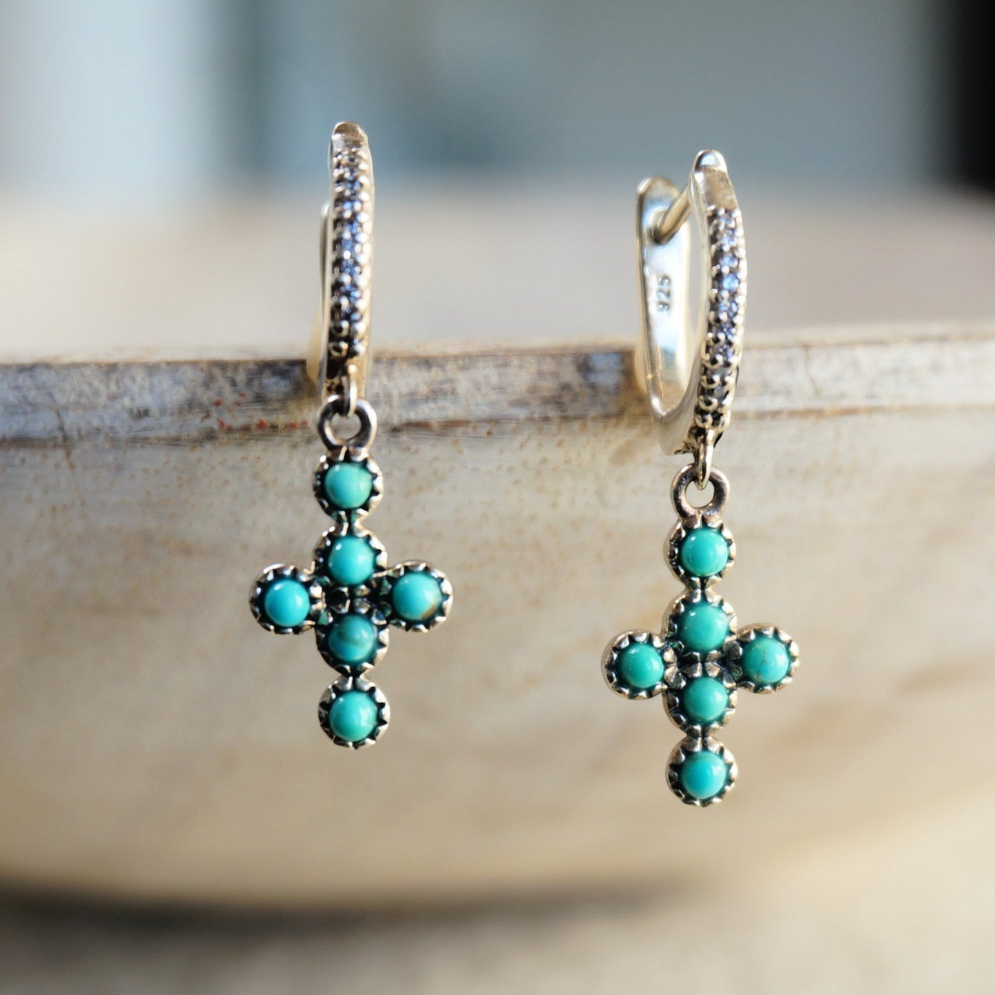 SOWELL JEWELRY turquoise cross hoop earrings in .925 sterling silver with a boho southwestern design.
