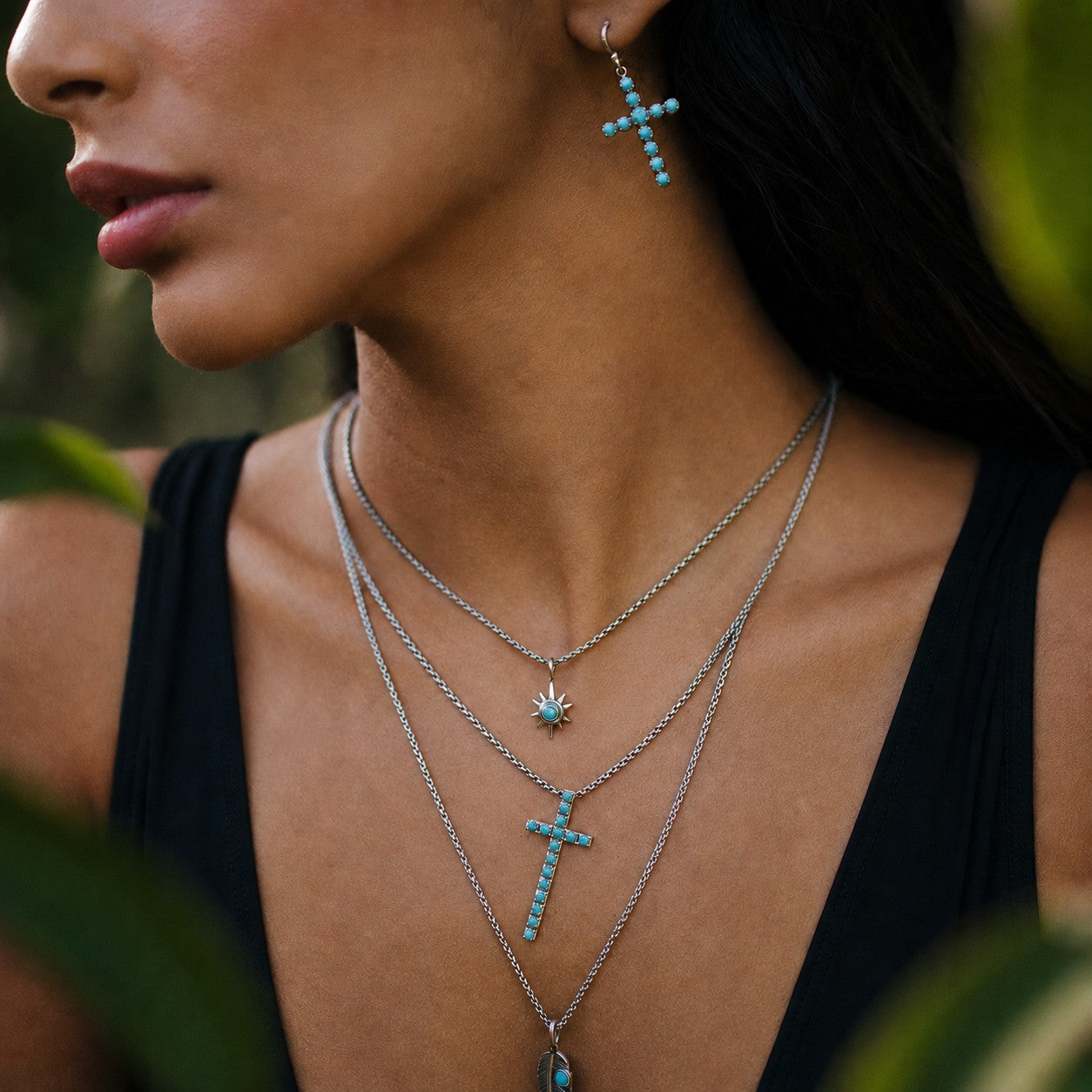 SOWELL JEWELRY Giada turquoise cross necklace and matching earring worn by a model in a boho style.