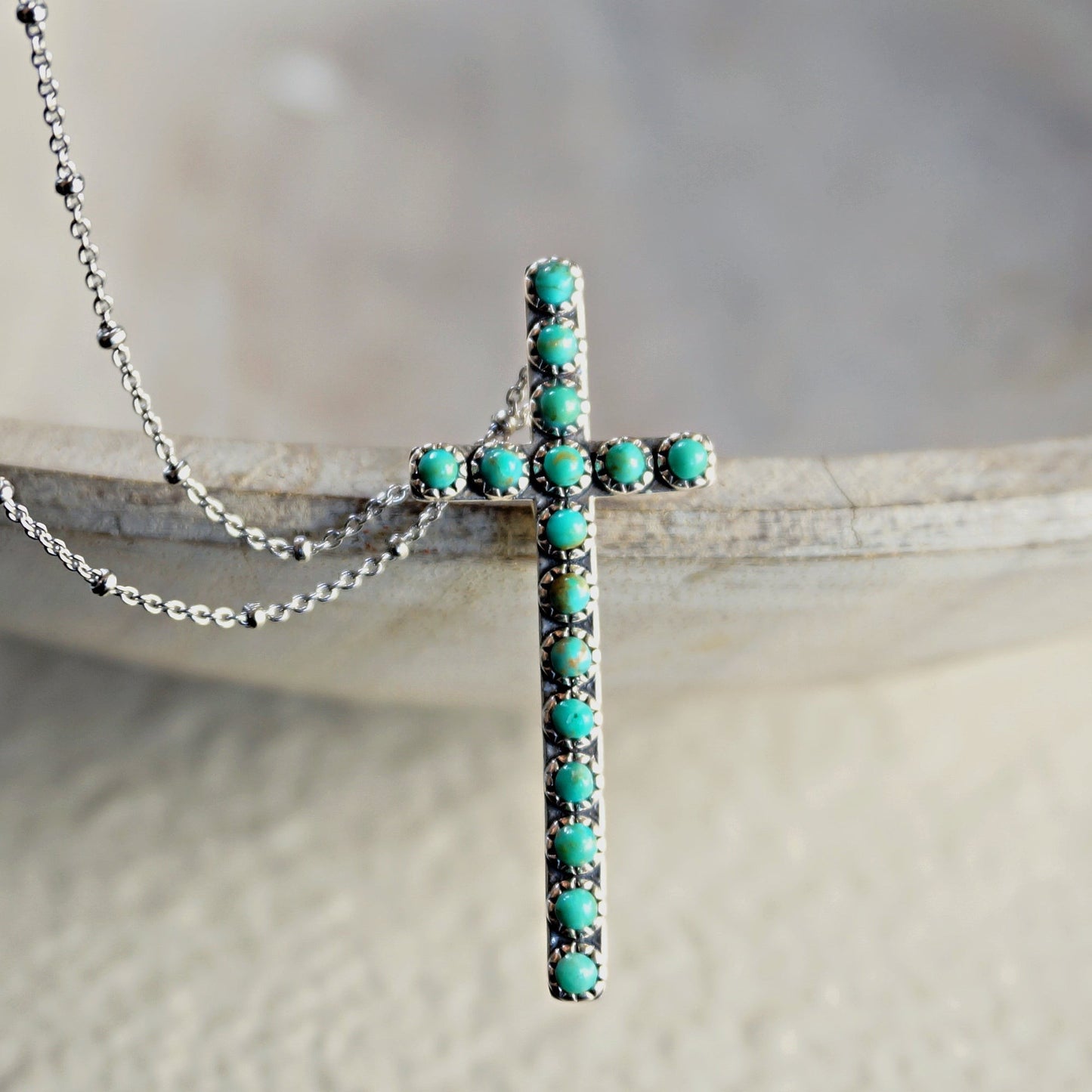 SOWELL JEWELRY Giada cross necklace featuring genuine blue turquoise stones set in handcrafted .925 sterling silver.