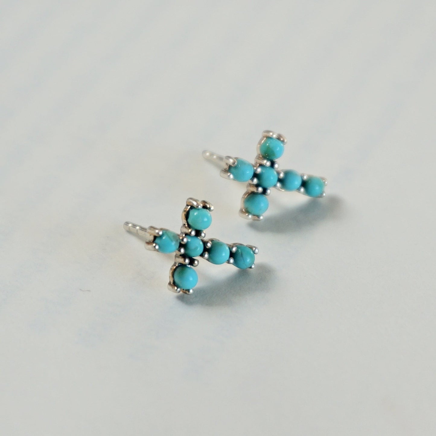 SOWELL JEWELRY turquoise cross stud earrings featuring genuine blue stones set in handcrafted .925 sterling silver.
