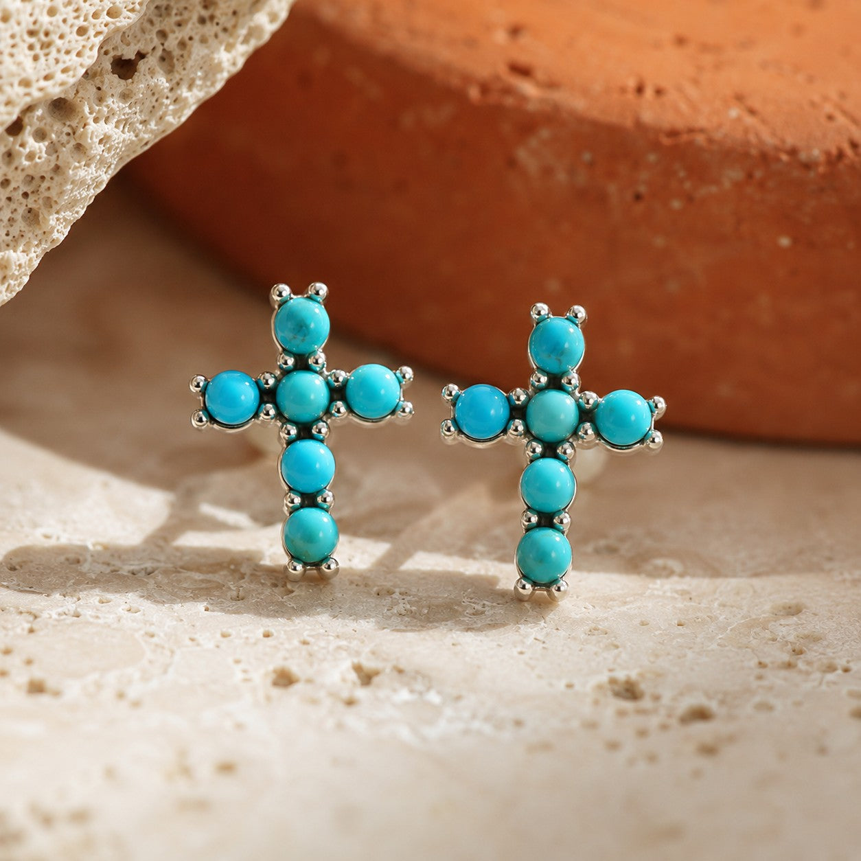 SOWELL JEWELRY turquoise cross stud earrings crafted from .925 sterling silver in a boho southwestern style.