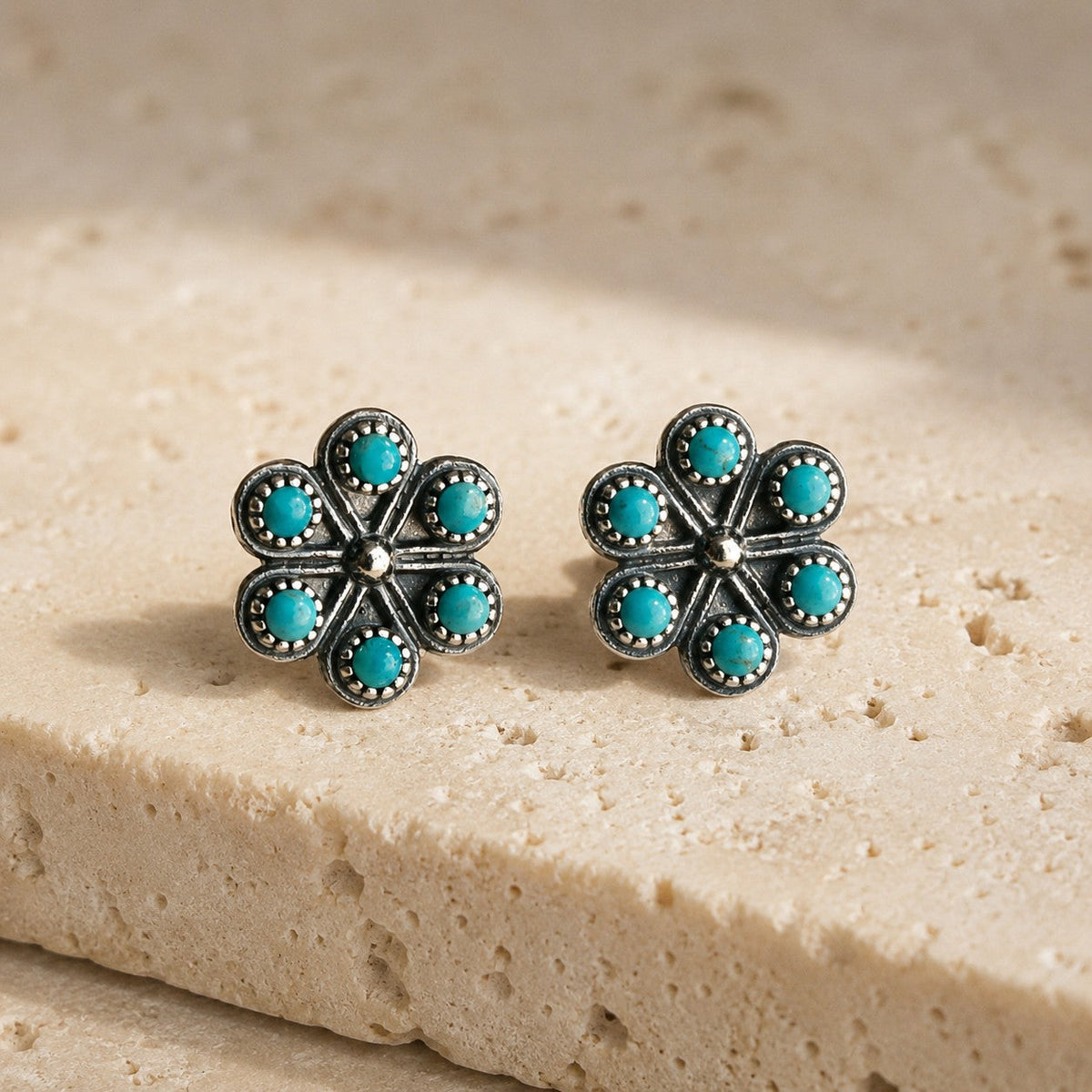 SOWELL JEWELRY Iris earrings featuring sterling silver flower designs with petite round turquoise stones.