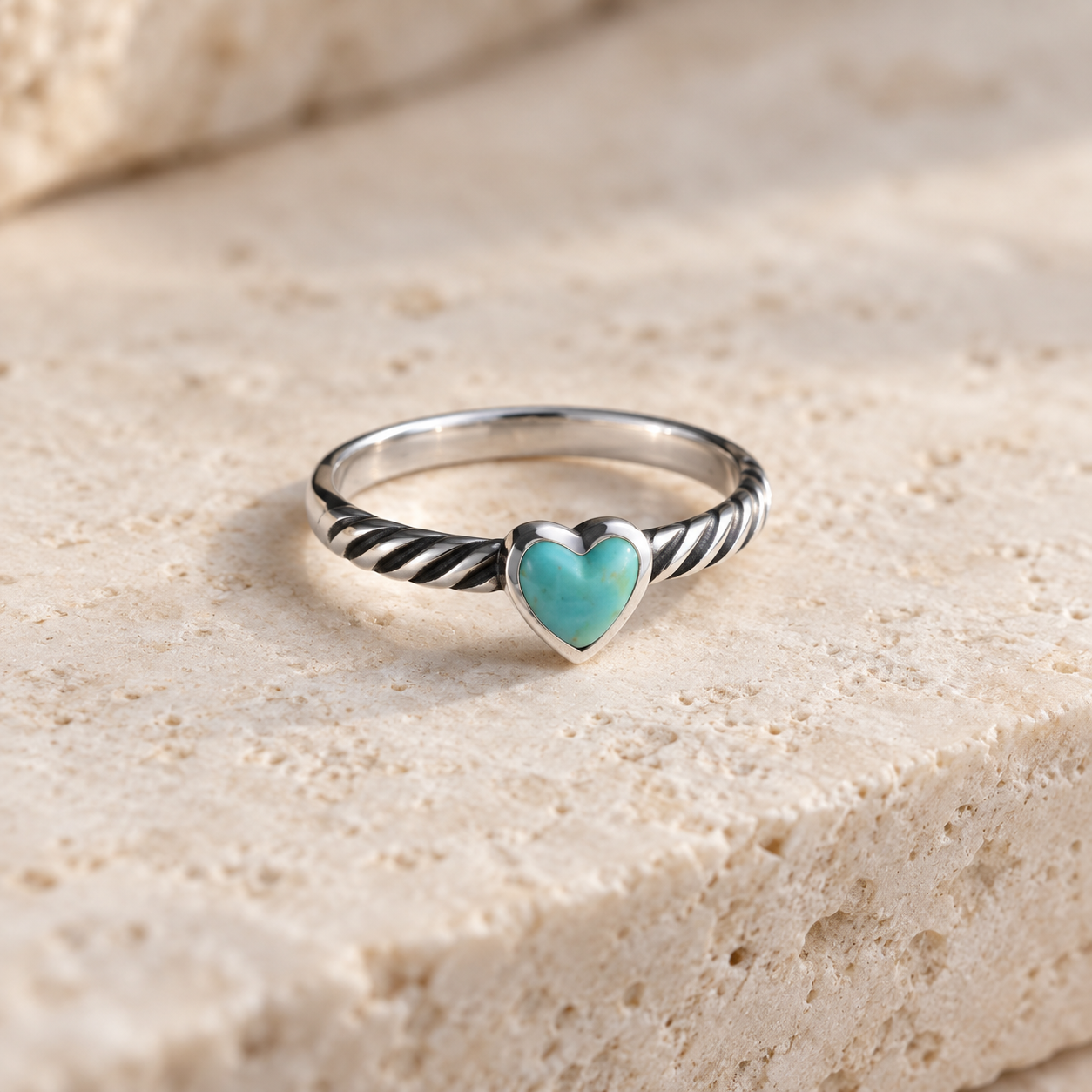 SOWELL JEWELRY sterling silver ring featuring a heart-shaped turquoise stone and a twisted rope band design.