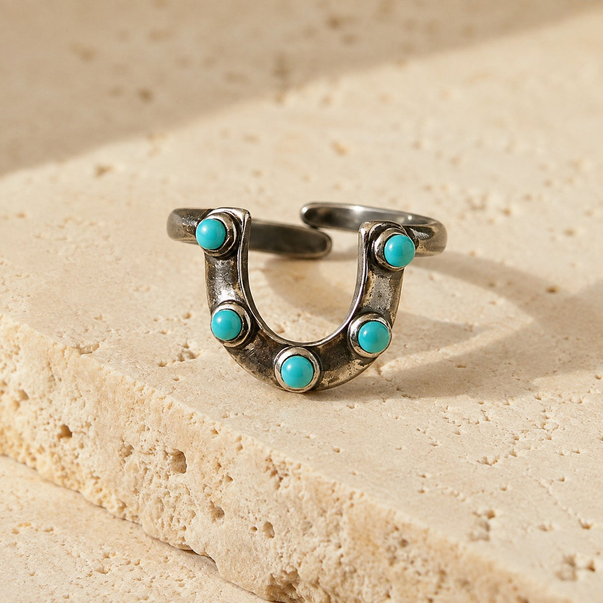 SOWELL JEWELRY adjustable sterling silver horseshoe ring featuring five small round turquoise stones on stone base