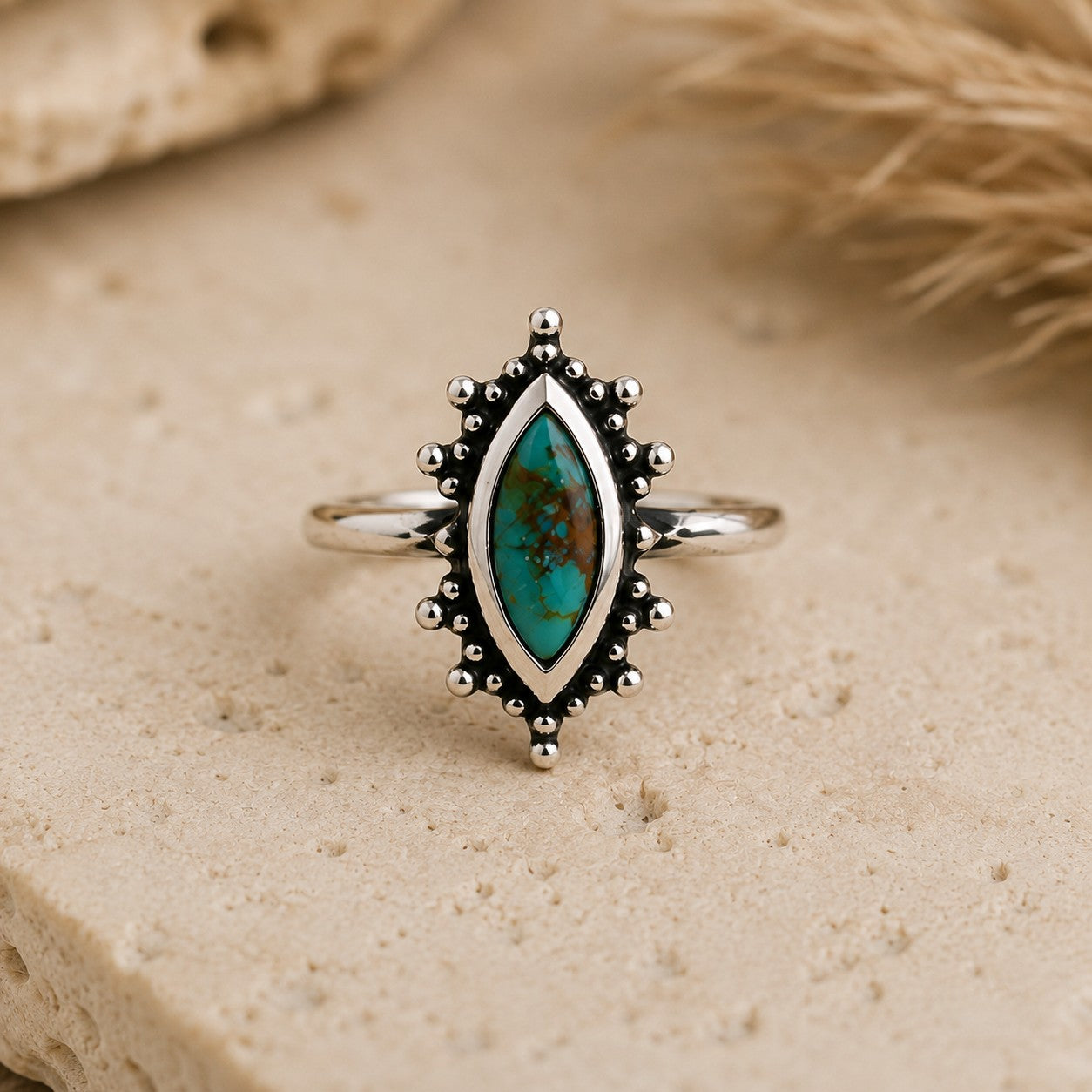 SOWELL JEWELRY Kal turquoise ring featuring a marquise stone in a handcrafted sterling silver setting on stone base.