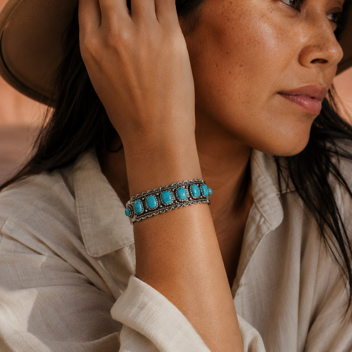 SOWELL JEWELRY Rayna sterling silver cuff bracelet featuring seven genuine turquoise stones on a woman's wrist