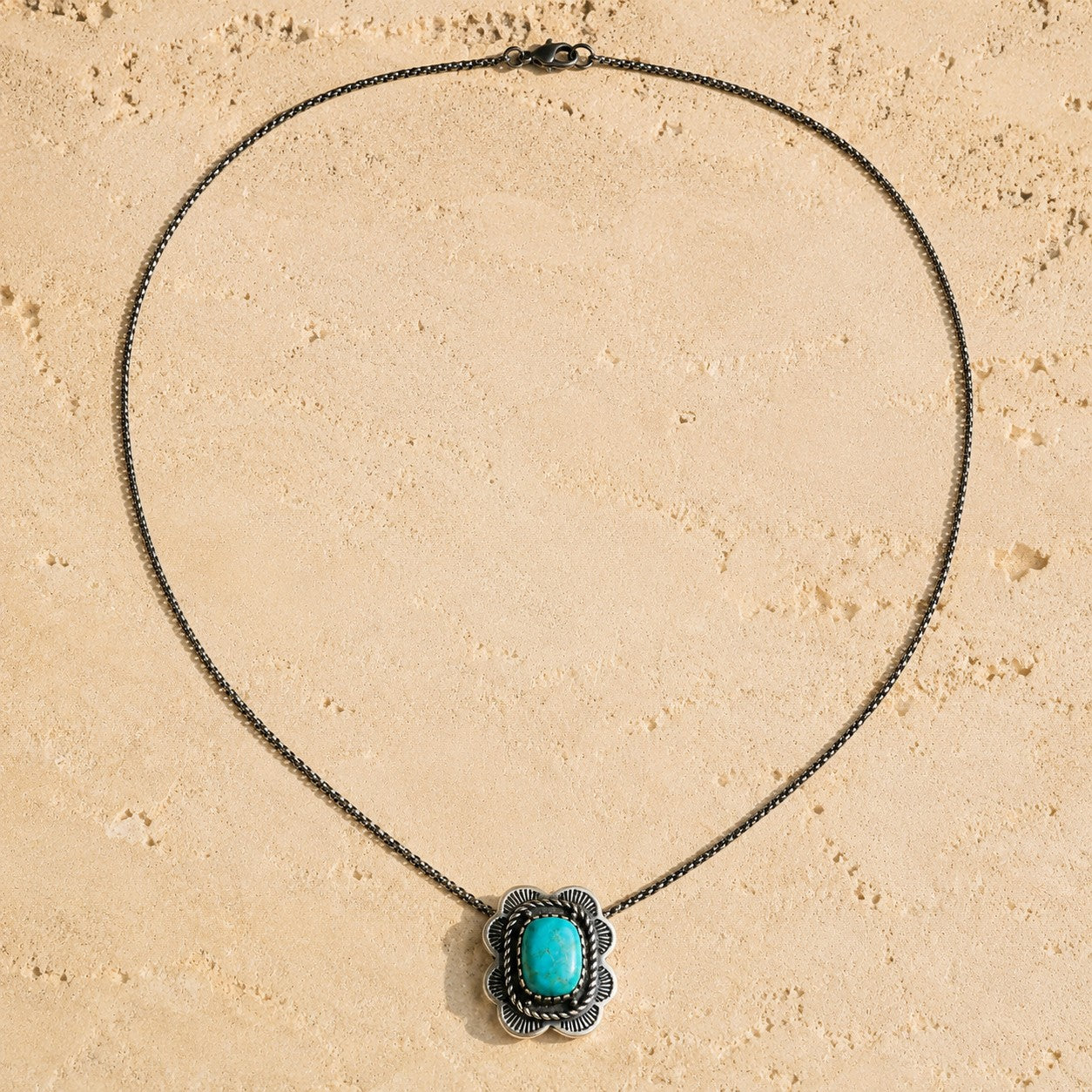SOWELL JEWELRY Asia turquoise necklace featuring a cushion-shaped stone in a sterling silver setting on a thin chain.