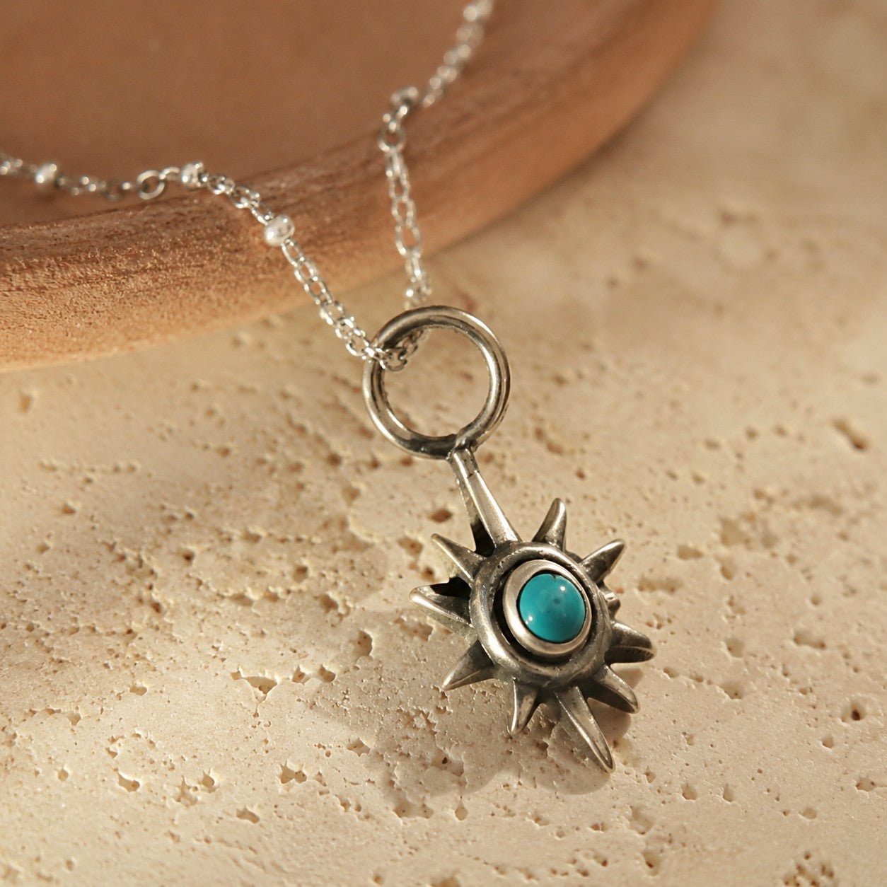 SOWELL JEWELRY sterling silver star pendant necklace featuring a central turquoise stone on an 18-inch chain