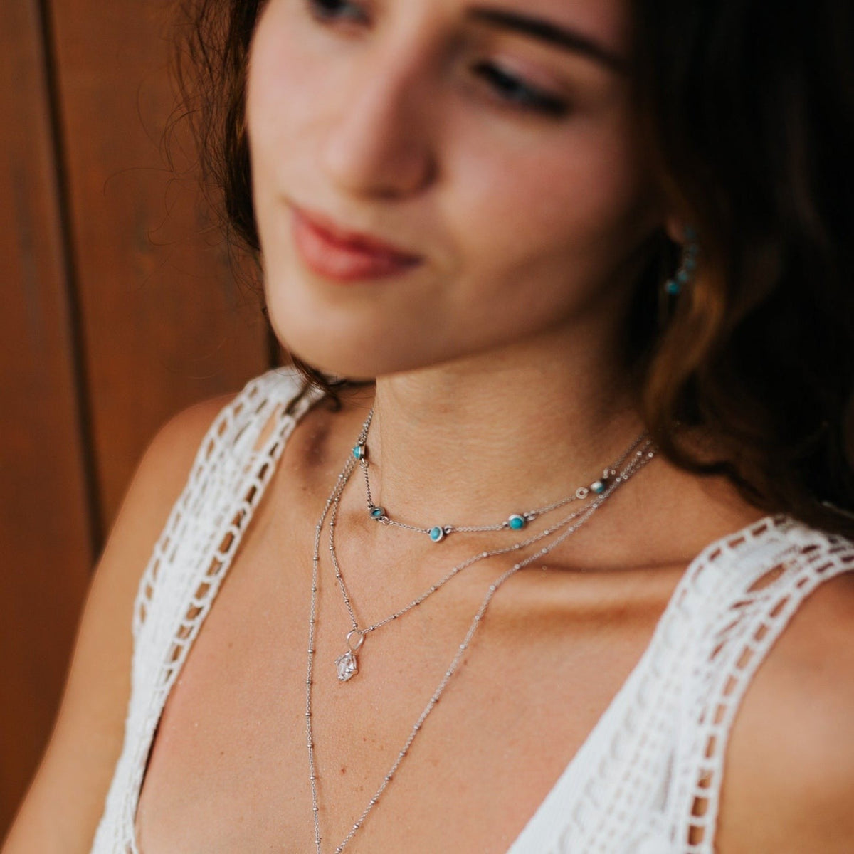 SOWELL JEWELRY sterling silver choker necklace featuring five genuine turquoise stones worn by a woman