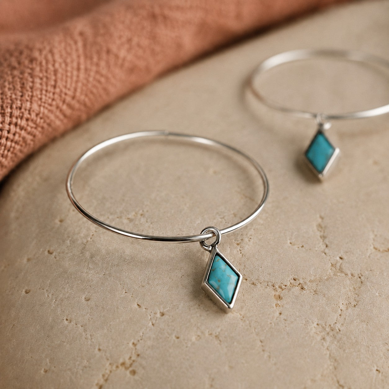 SOWELL JEWELRY Dir hoop earrings featuring genuine turquoise diamond-shaped stones set in .925 sterling silver.