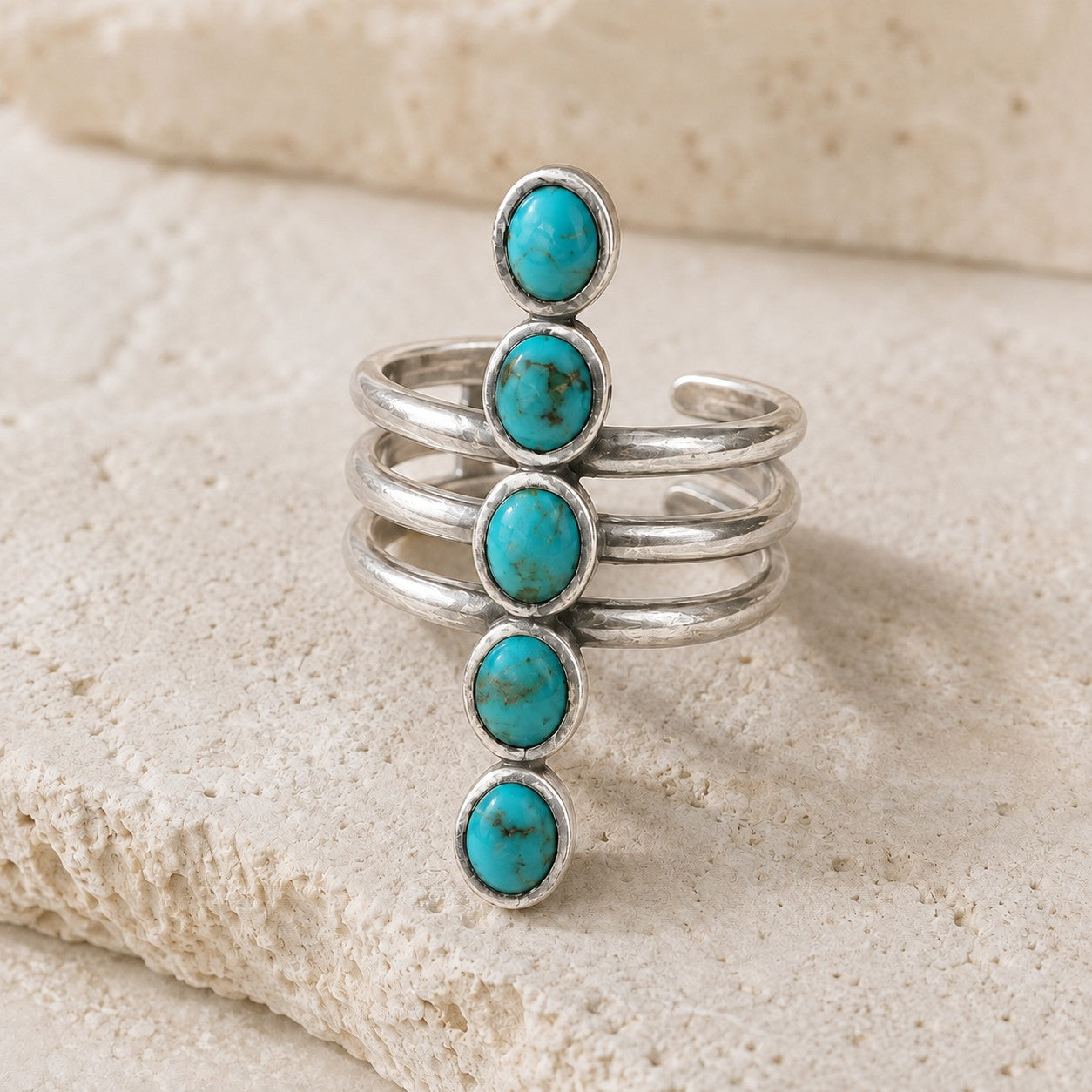 SOWELL JEWELRY Kachada ring featuring five turquoise stones set in a handcrafted .925 sterling silver adjustable band.