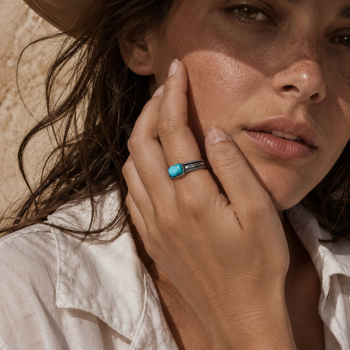 SOWELL JEWELRY Abha turquoise ring in sterling silver worn on a woman's finger, featuring a boho southwestern style.