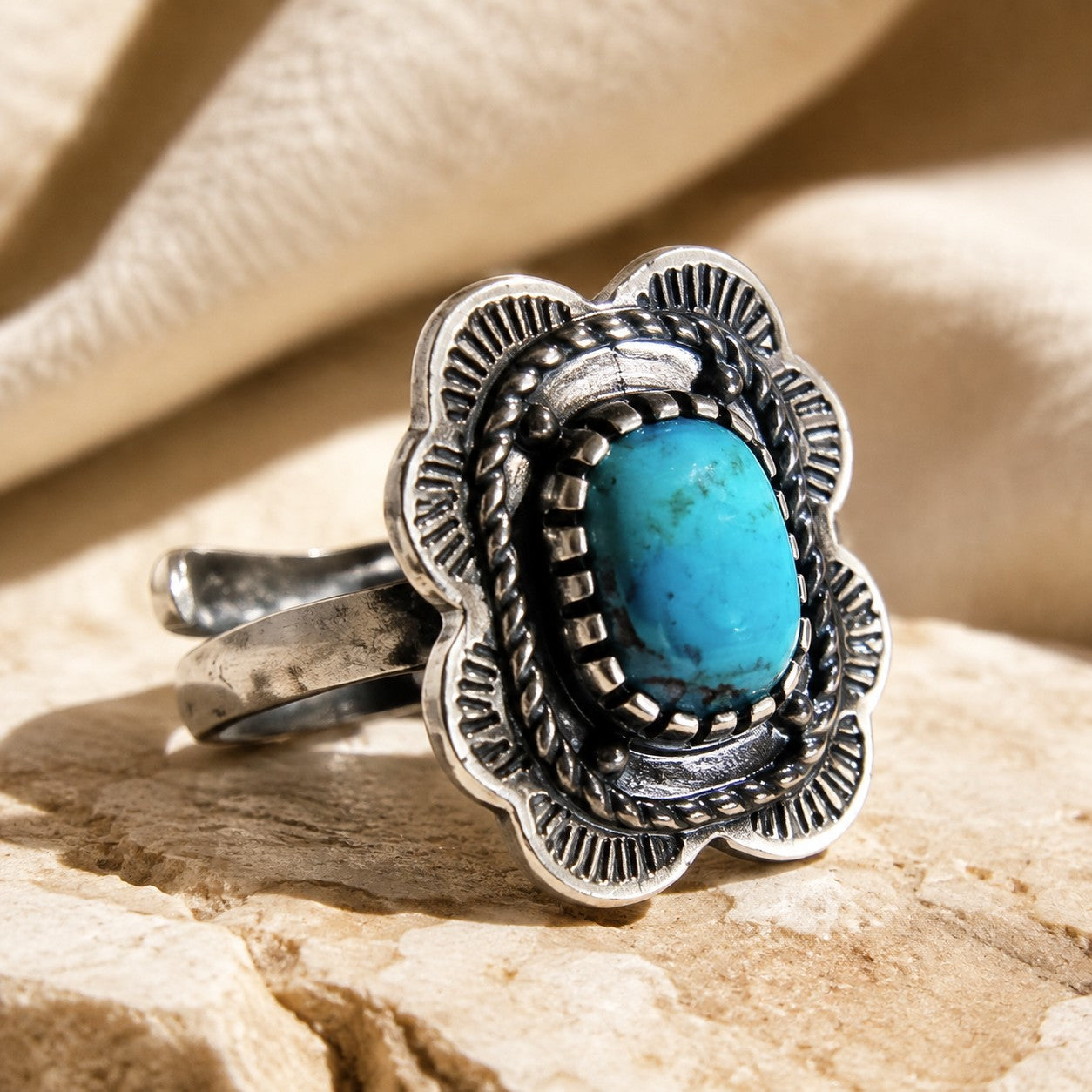 SOWELL JEWELRY Asia Solitaire ring featuring a cushion-shaped turquoise stone set in ornate sterling silver