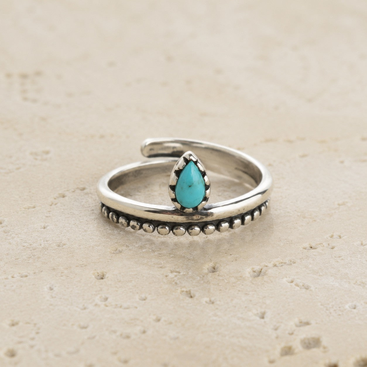 SOWELL JEWELRY Bipana turquoise ring featuring a teardrop stone in a handcrafted sterling silver beaded band.