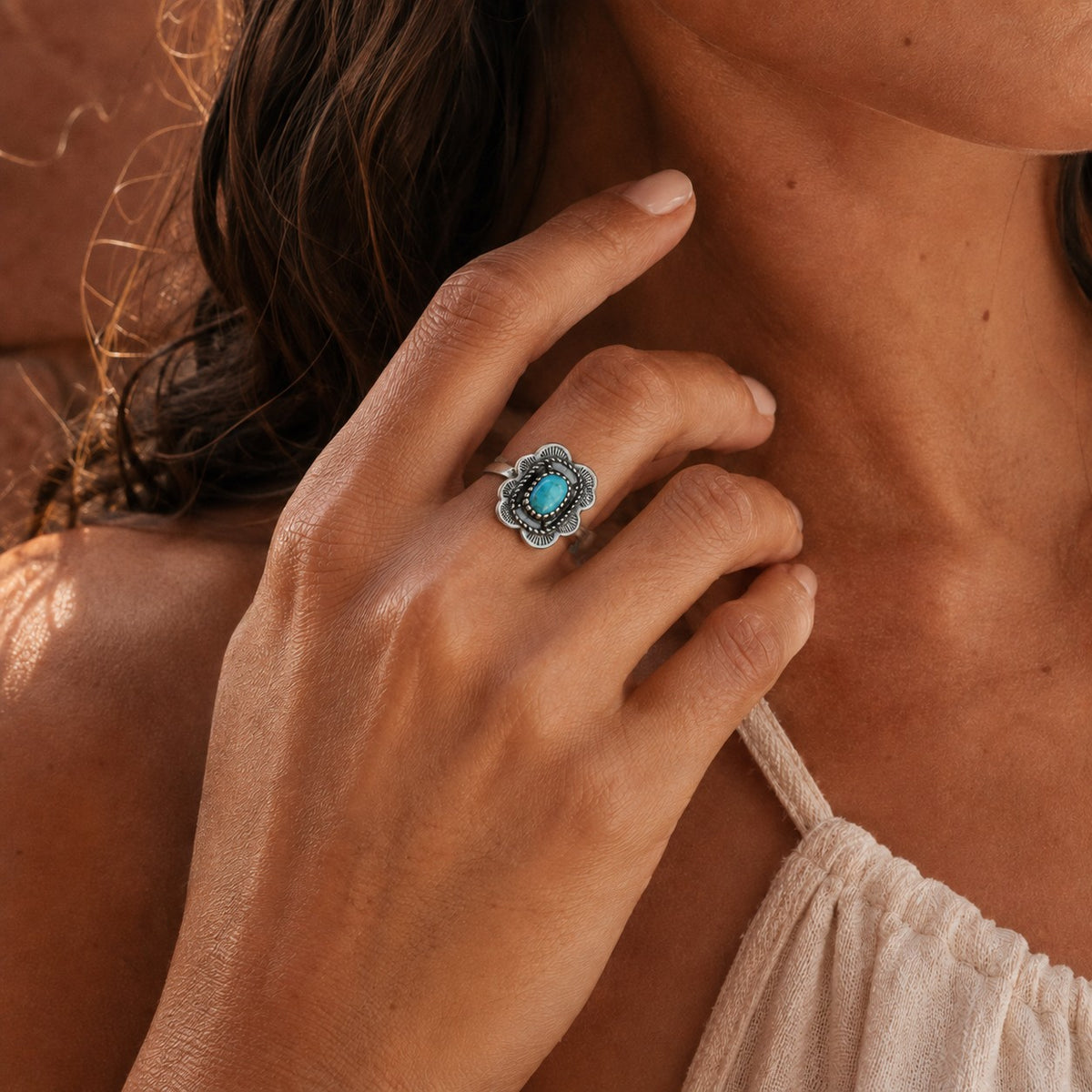 SOWELL JEWELRY Asia Solitaire ring featuring a cushion-shaped turquoise stone set in an adjustable sterling silver band
