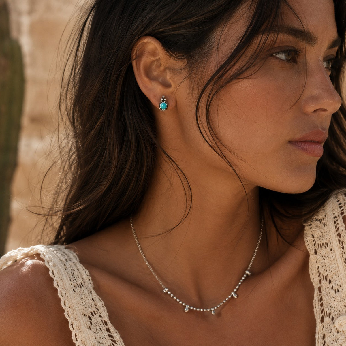 SOWELL JEWELRY Derya stud earrings featuring genuine turquoise in handcrafted .925 sterling silver on a woman