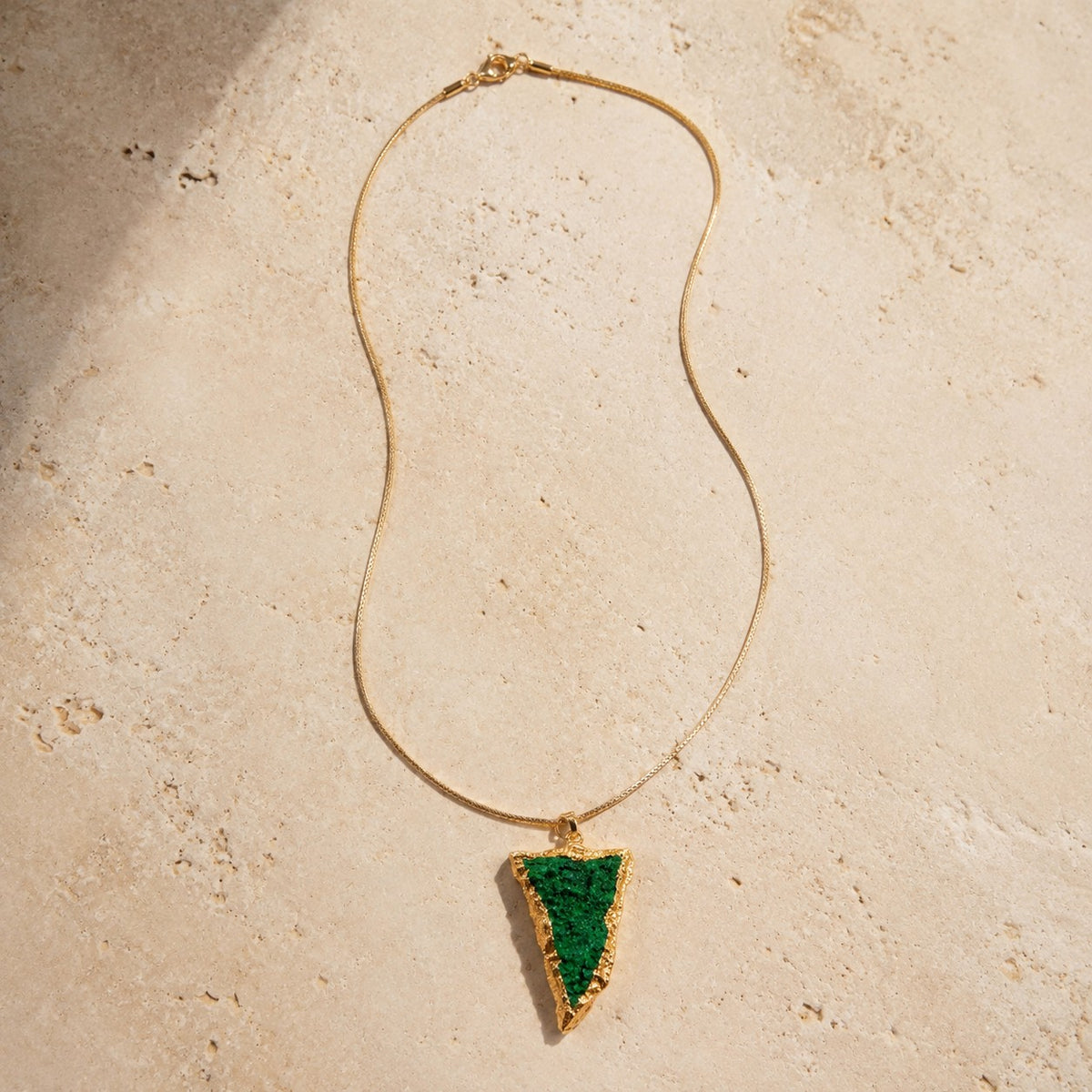 SOWELL JEWELRY Sara pendant featuring a raw emerald-green uvarovite garnet cluster in an 18K gold-filled setting.