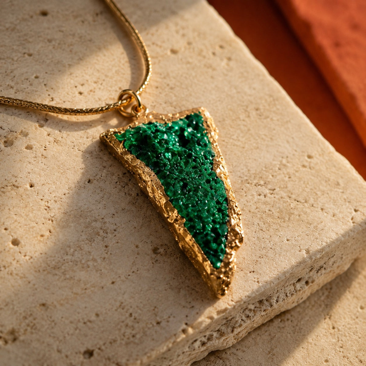SOWELL JEWELRY Sara pendant featuring a raw emerald-green uvarovite garnet cluster in an 18K gold-filled setting.