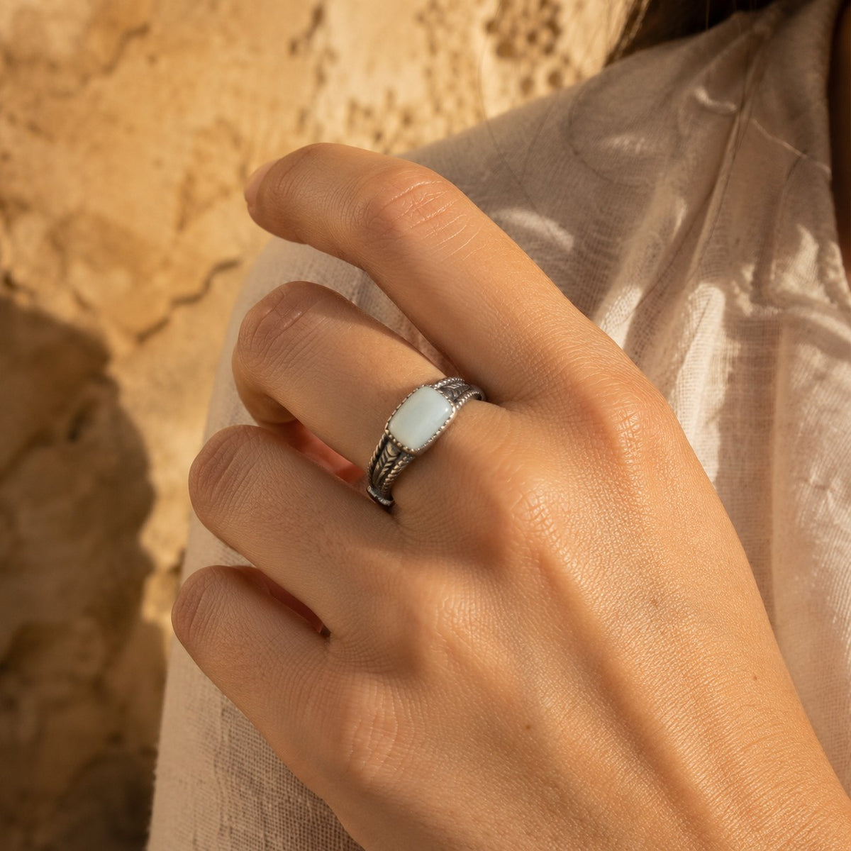 SOWELL JEWELRY Abha adjustable ring featuring a white agate stone set in a sterling silver arrow-inspired band.