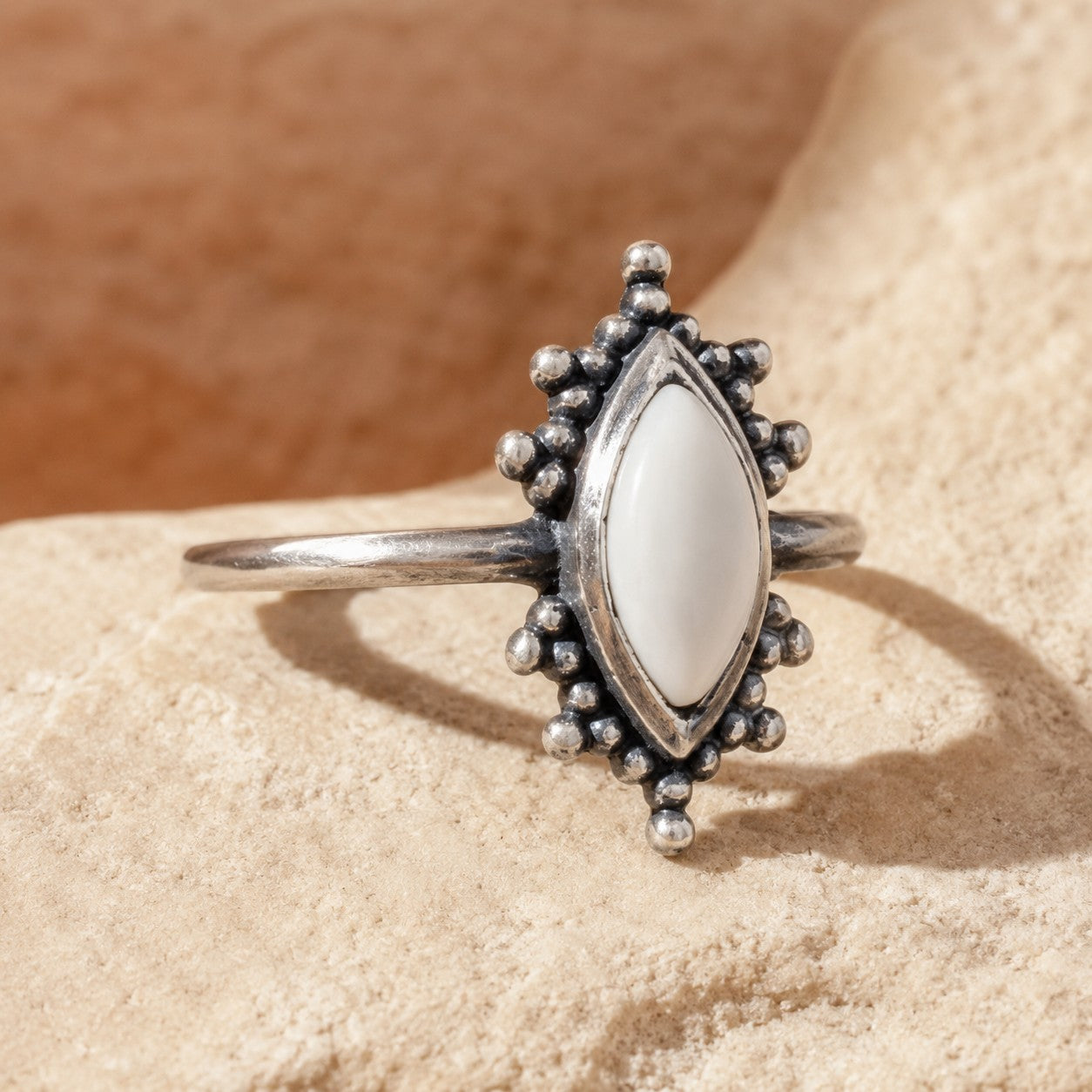 SOWELL JEWELRY Kal ring featuring a marquise-cut white agate stone set in oxidized .925 sterling silver on stone.